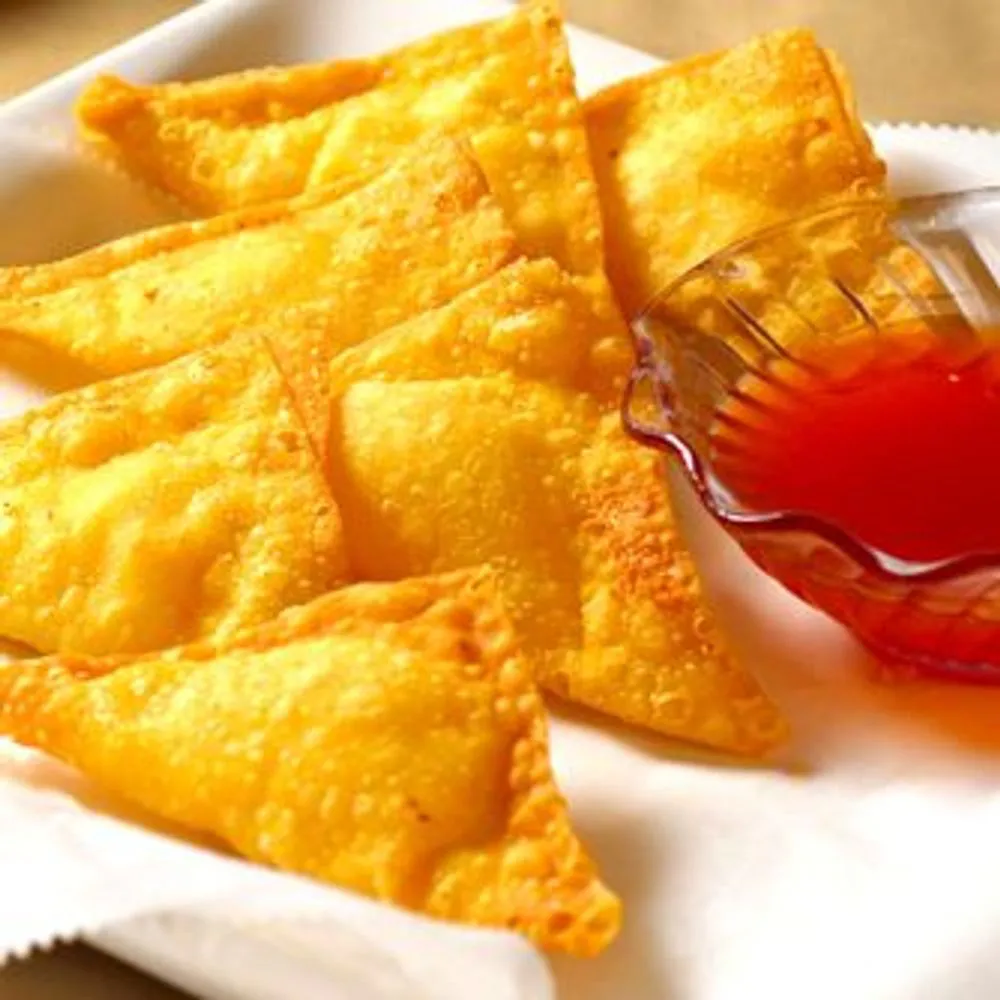Crispy fried cheese wontons served with sweet red dipping sauce at Golden Dragon Restaurant, a Chinese Restaurant in East Troy